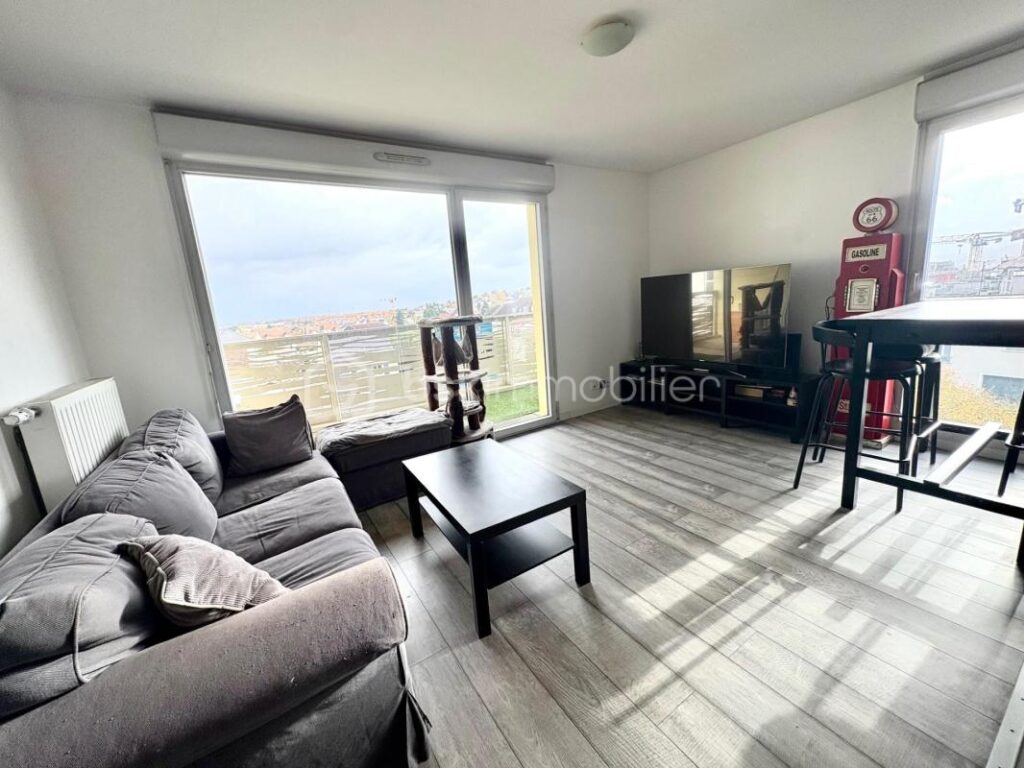 Appartement F4 avec balcon et 2 places de parkings en sous sol – 4 pièces – 3 chambres – 74 m²