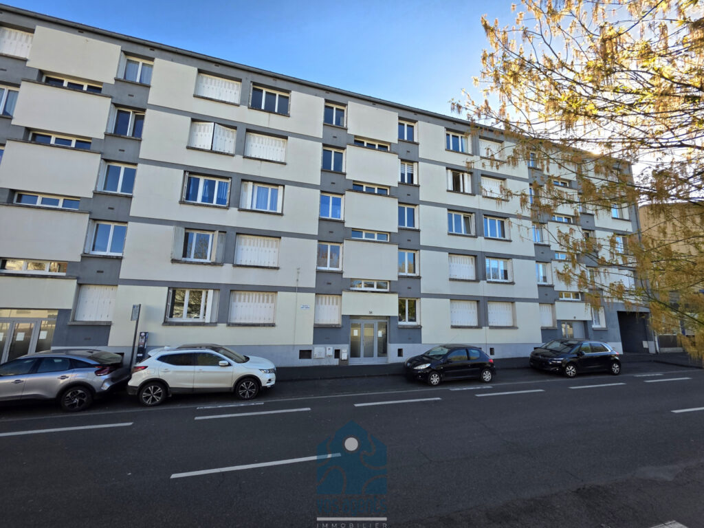 Appartement 3 pièces avec balcon, cave et stationnement – 3 pièces – 2 chambres – 61.5 m²